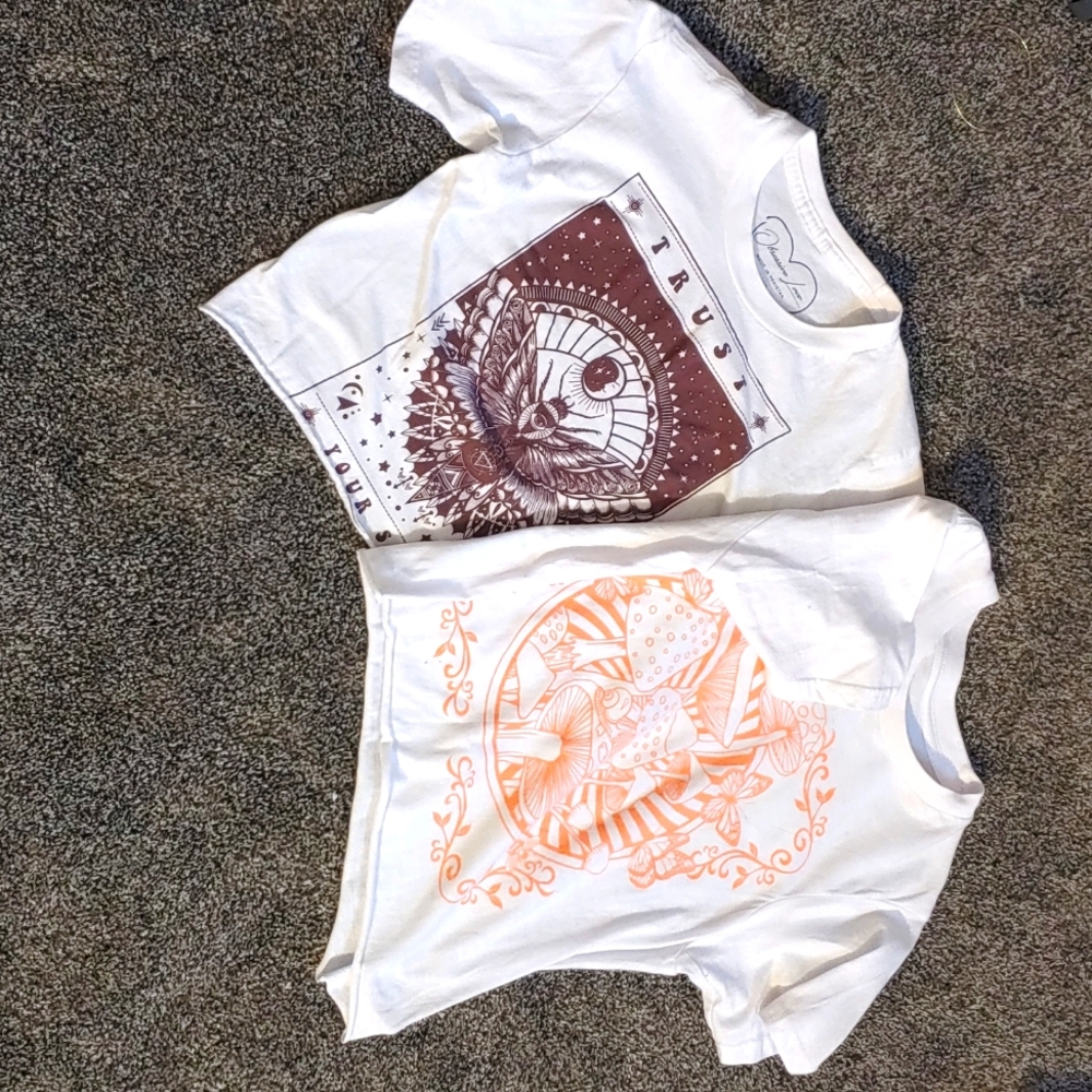 2 cropped white shirts w/ design